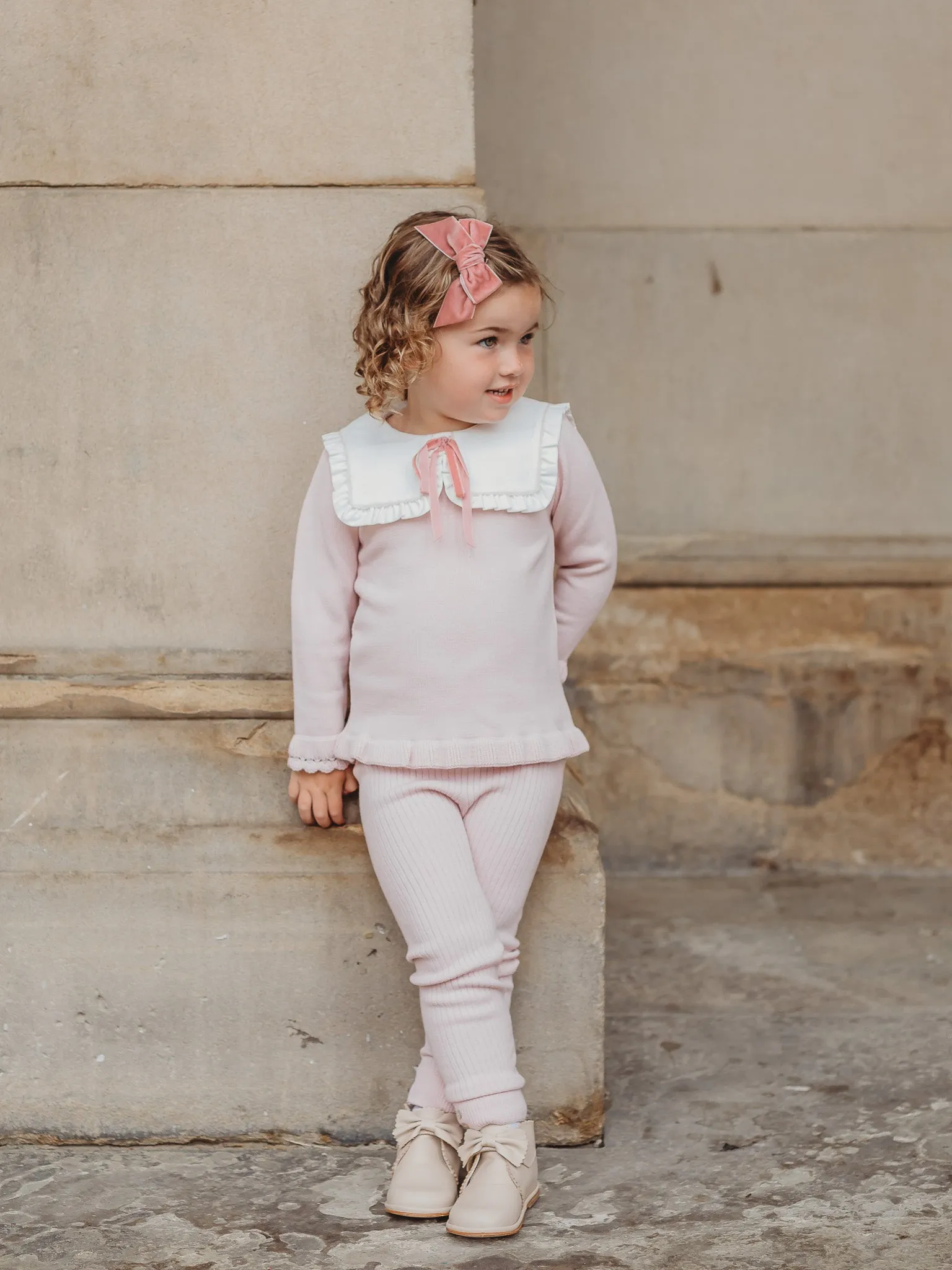 'Etta' pink knitted suit with bib collar