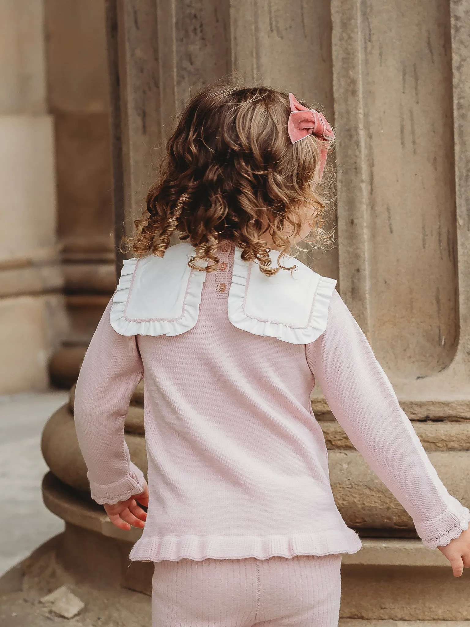 'Etta' pink knitted suit with bib collar