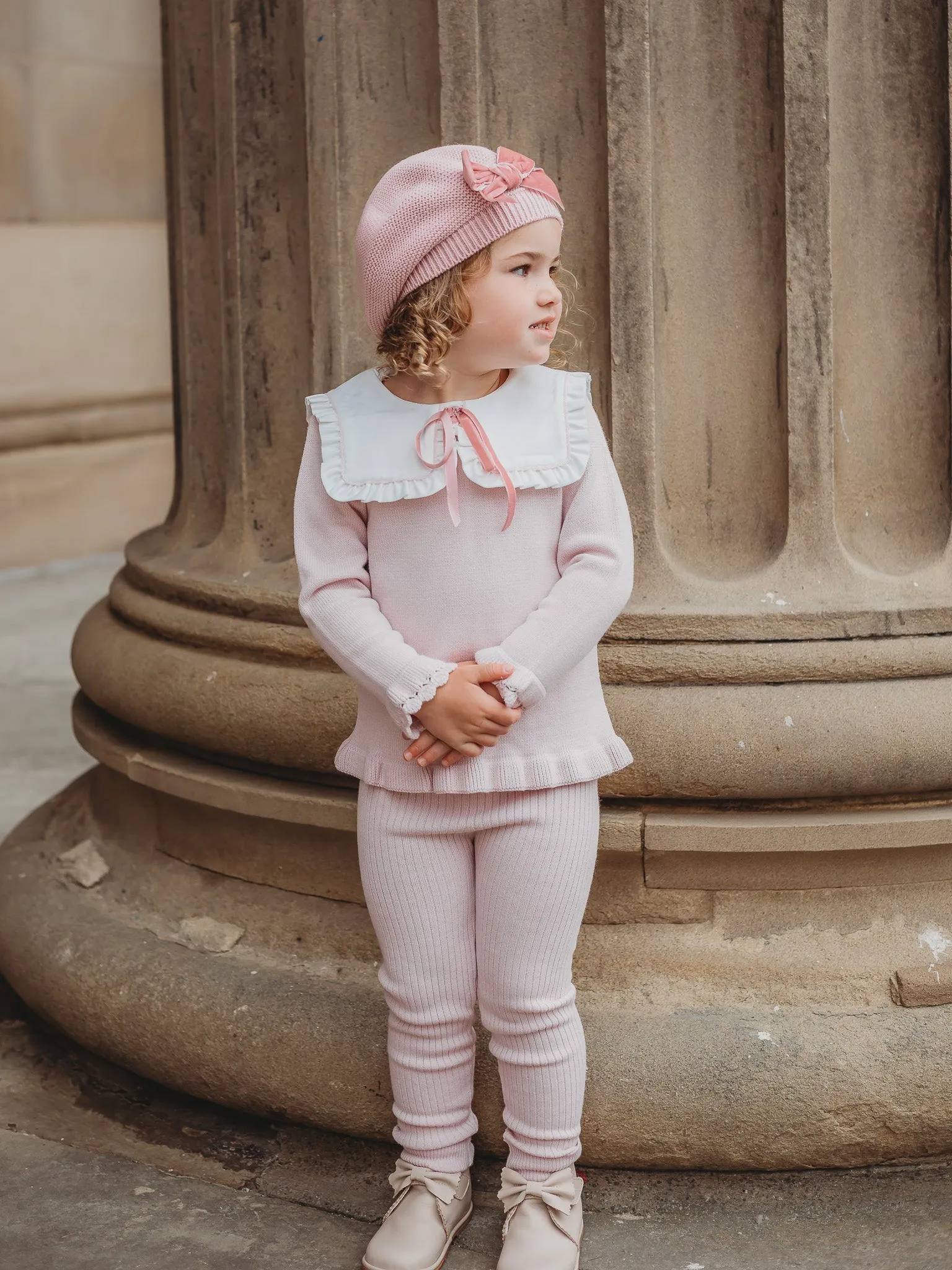 'Etta' pink knitted suit with bib collar