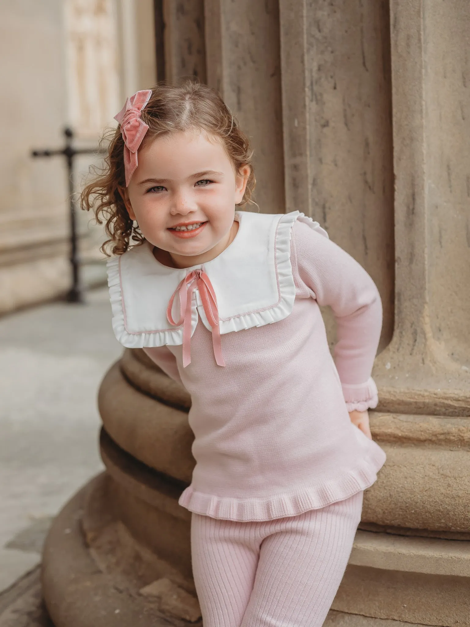 'Etta' pink knitted suit with bib collar